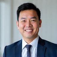 Professional headshot of John Chen, CEO of Oceanic Front